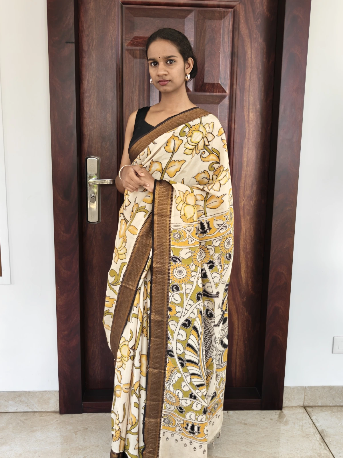 Cream and Yellow Lotus Kalamkari Silk with Nizam Border Saree
